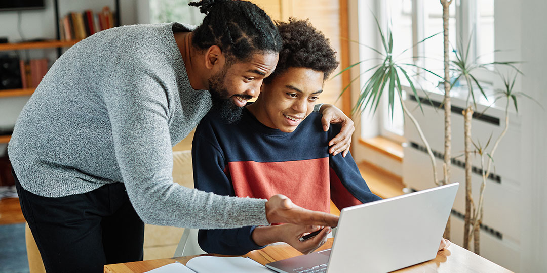 A father helps his son plan for college.